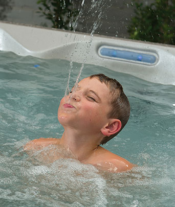 American Whirlpool Hot Tub Boy Spraying Water